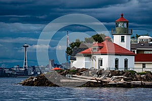 Alki Poinr Lifhrhouaw with Space Needle in background, Seattle, WA, USA