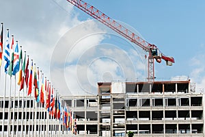 All European Countries flags with construction building crane in