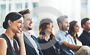 we are all excited for the seminar. a group of businesspeople sitting in the conference room during a seminar.