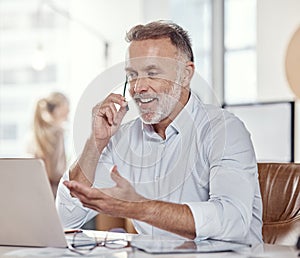 All the experience youd want from a support professional. a mature man using a headset and laptop in a modern office.