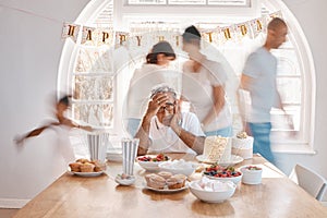 All great and precious things are lonely. Shot of a senior man looking lonely while celebrating his birthday alone at