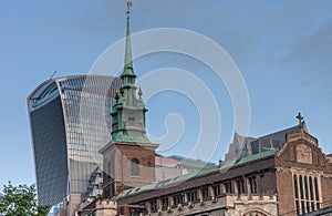 All Hallows by the Tower, anglican church in the city of London, on background skyscraper