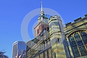 All Hallows by the Tower Church in the financial district of the City of London with 20 Fenchurch Street Walkie Talkie in the ba photo