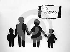 All lives matter, symbol of an interracial family cut out of black and white paper. no to racism. Mixed race family set