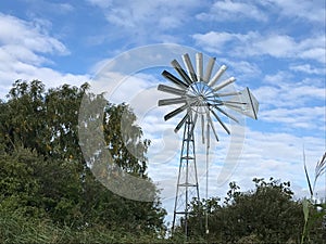 All metal wind pump with blue sky