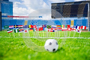 All nations flag on football green grass. Football net and blue sky in background