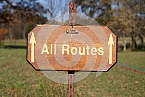 All Routes sign with forward pointing arrows