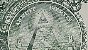 The All-Seeing Eye Sign Rotates on a One Dollar Bill Close-Up