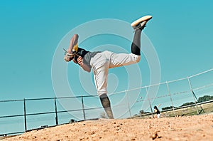 All it takes is all youve got. Shot of a young baseball player pitching the ball during a game outdoors.