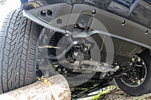 An all-terrain car climbs up trunks photo