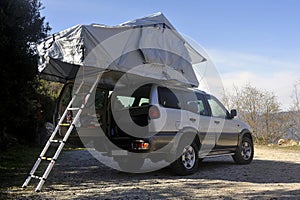 All terrain car with a roof tent