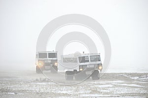 The all-terrain vehicle for snow trips to a snow blizzard in the tundra. Special car for the Arctic safari.