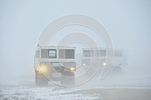 The all-terrain vehicle for snow trips to a snow blizzard in the tundra. Special car for the Arctic safari.