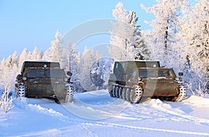 All-terrain vehicles GAZ-71 on the background of the snow-covered taiga of Yamal
