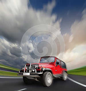 All-wheel drive car at the deserted highway photo