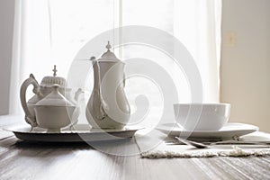 All white tea set and dinnerware