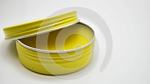 Yellow color pomade with aluminium tin can isolated with white background
