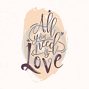 All You Need Is Love romantic phrase or quote written with elegant cursive font against pink round paint blot on