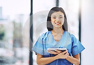 All your medical records are on my digital tablet. Cropped portrait of an attractive young female doctor holding a