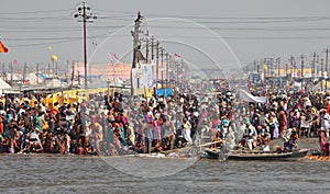 Hindu devotees come to confluence of the Ganges for holy dip during the festival Kumbh Mela