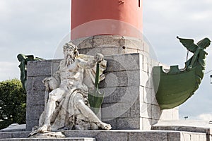 Allegorical sculpture of the Dnieper River and rostra at the base of the rostral column in St. Petersburg, Russia