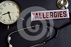 Allergies on the paper with Healthcare Concept Inspiration. alarm clock, Black stethoscope.