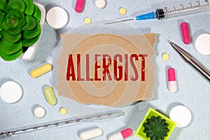 allergist colorful word on the wooden background with stethoscope