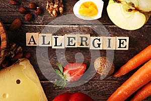 Allergy food concept. Allergy food as almonds, milk, cheese, strawberry, eggs, peanuts and .crustaceans or shrimps with wooden