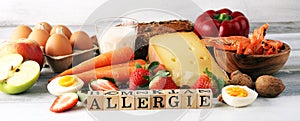 Allergy food concept. Allergy food as almonds, milk, cheese, strawberry, eggs, peanuts and .crustaceans or shrimps with wooden