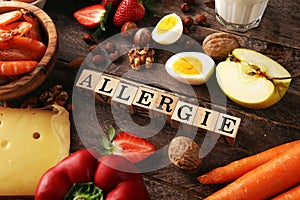 Allergy food concept. Allergy food as almonds, milk, cheese, strawberry, eggs, peanuts and .crustaceans or shrimps with wooden