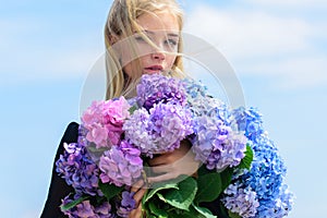 Allergy free life. Stop allergy blooming season. Girl tender blonde hold hydrangea bouquet. Springtime bloom. Pollen