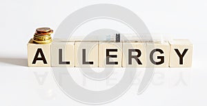 Allergy word written on wooden cubes on a white background. Medicine