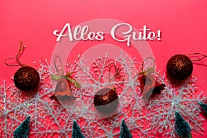 Alles Gute text isolated on Pink backgroud. It means Best Wishes. Frame of Christmas Decoration