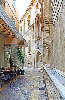Alley with Cafe and Sagredo Fountain in Heraklion, Greece