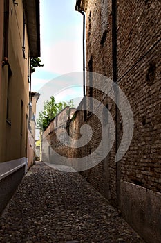 Alley in an italian town at sunset in summer