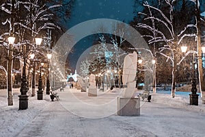 Alley with lanterns and sculptures near Ufa Medical University at evening