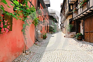 Alley in medieval Riquewihr town, France