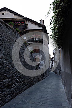 Alley in the mountain village in Bard, vertical image