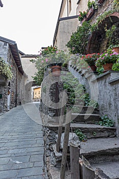 Alley in the mountain village in Bard, vertical image