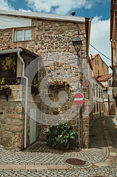 Alley with NO ENTRY signpost and old houses