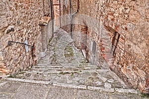 Alley in the old village Castiglione d'Orcia, Siena, Tuscany, It