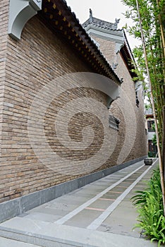 Alley planted with bamboo between Chinese old-fashioned building
