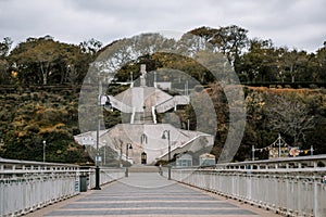 Alley of a sea bridge overlooking to stairs in the sea garden of Burgas. Autumn season mood colours.