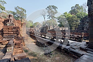 Alley on territory of the 12th century Preah Khan temple, Cambodia. Historical ruins in ancient forest in Angkor