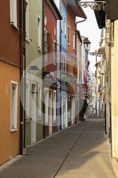 Alleys and streets among the colorful houses of the seaside village of Caorle