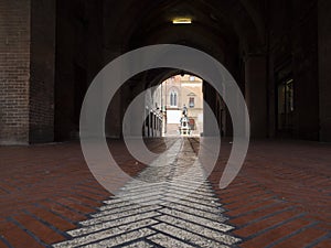 Alleyway of Bologna under a portico