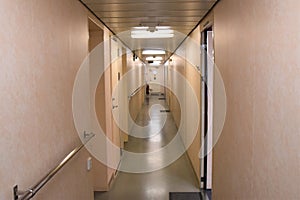 Alleyway or corridor inside the superstructure of merchant container vessel photo