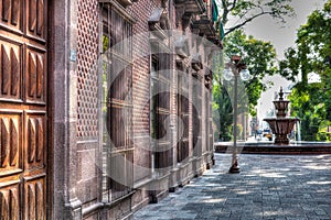 Alleyway in Jardin de San Francisco with water fountain