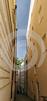 Alleyway in Passau, Germany, with storm clouds above