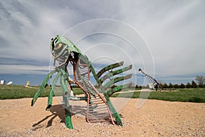 Alliance, Nebraska/USA - May 8th 2018: A peculiar metal sculpture of a fish leaping out of the ground in Nebraska